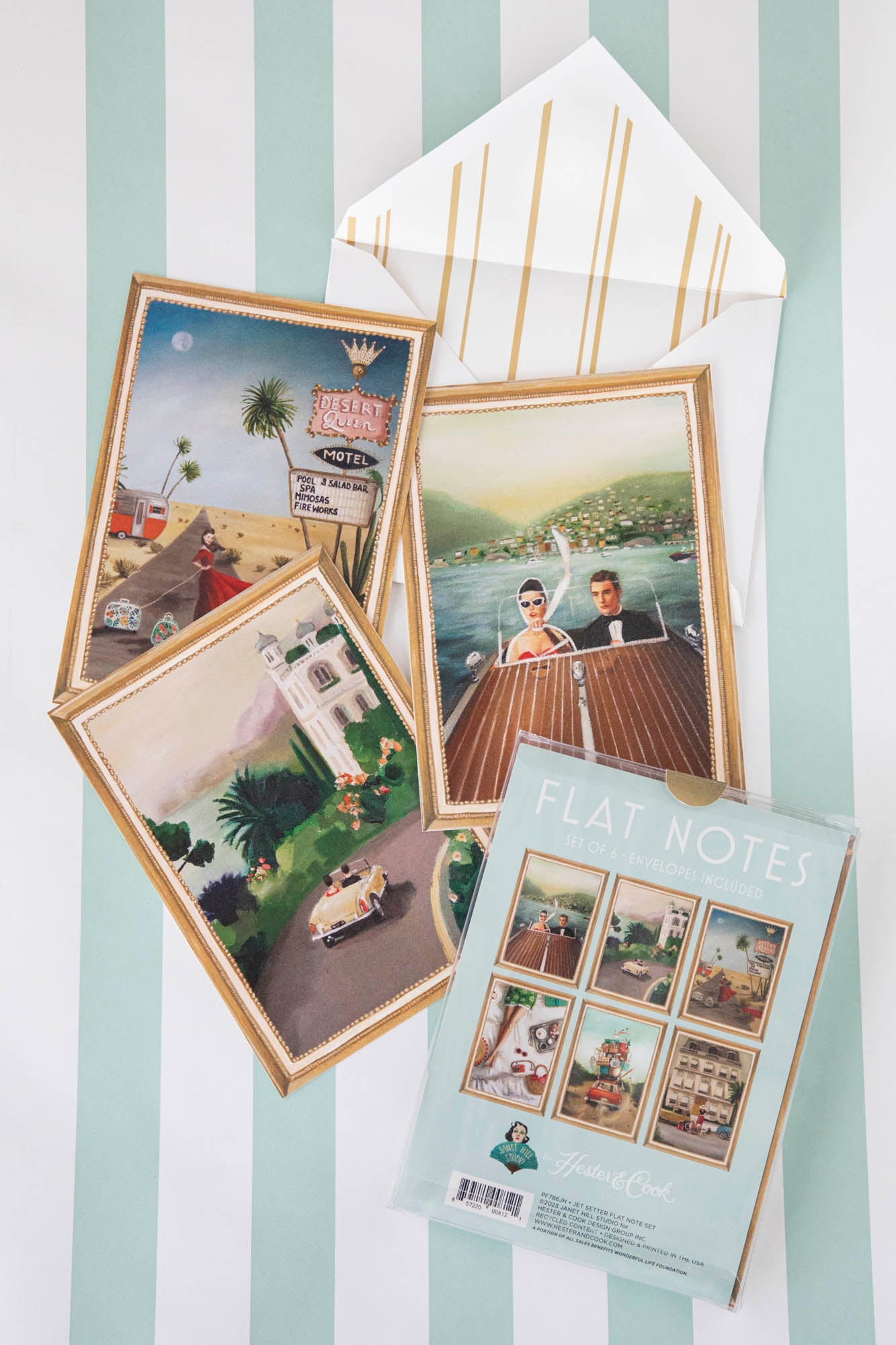 A top-down view of three of the Jet Setter Flat Note designs next to the retail packaging, featuring a white envelope with a gold striped interior.