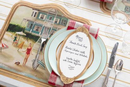 The Die-cut Beach House Placemat under an elegant place setting, at an angle.