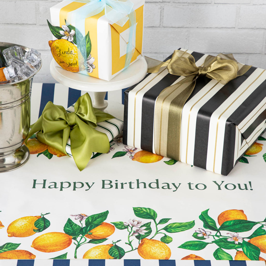An elegant birthday table with the Lemons Personalized Runner, &quot;Happy Birthday to You!&quot; printed in green down the middle.