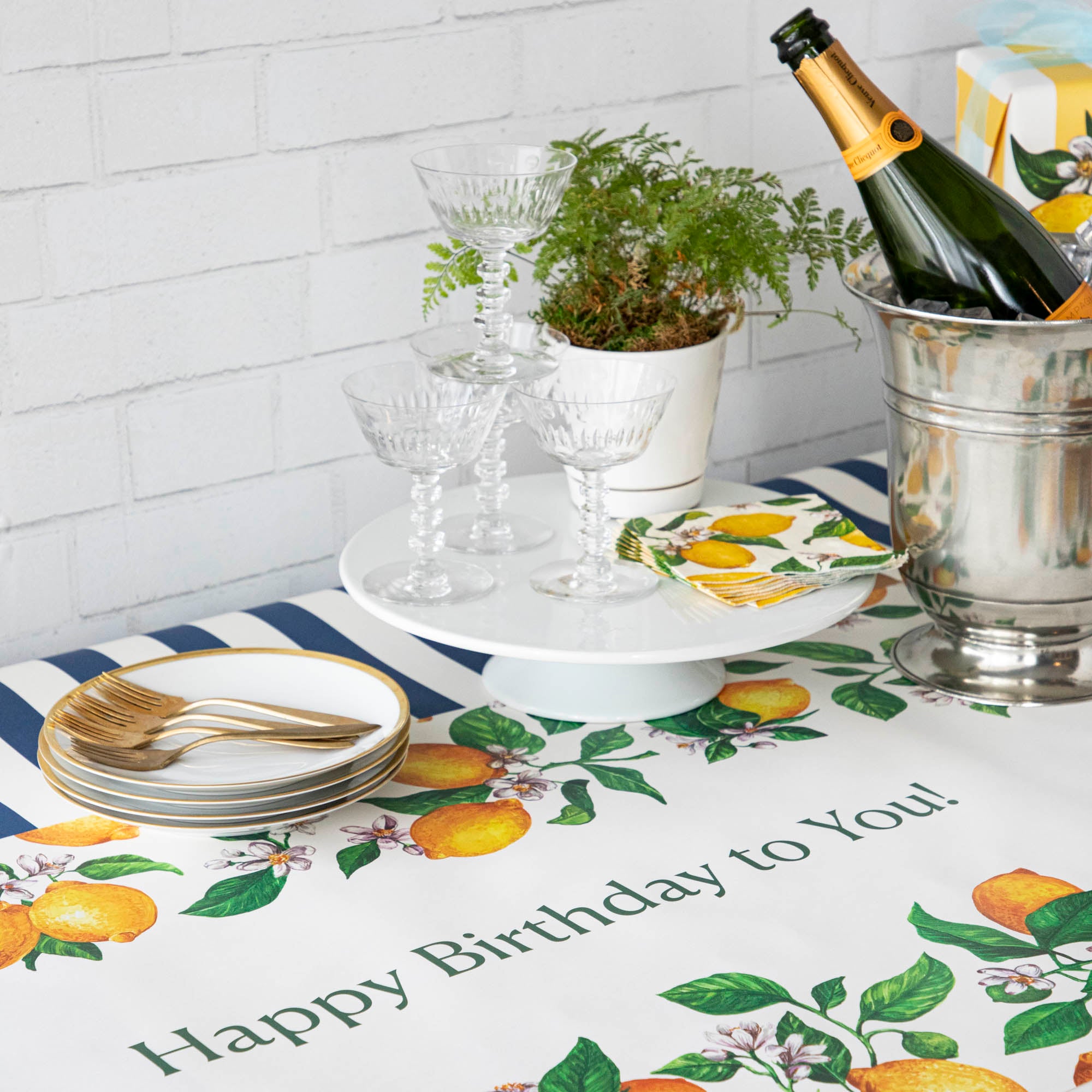 An elegant birthday table with the Lemons Personalized Runner, "Happy Birthday to You!" printed in green down the middle.