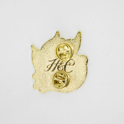A Lemon Enamel Pin with a monogram on it by Hester &amp; Cook.