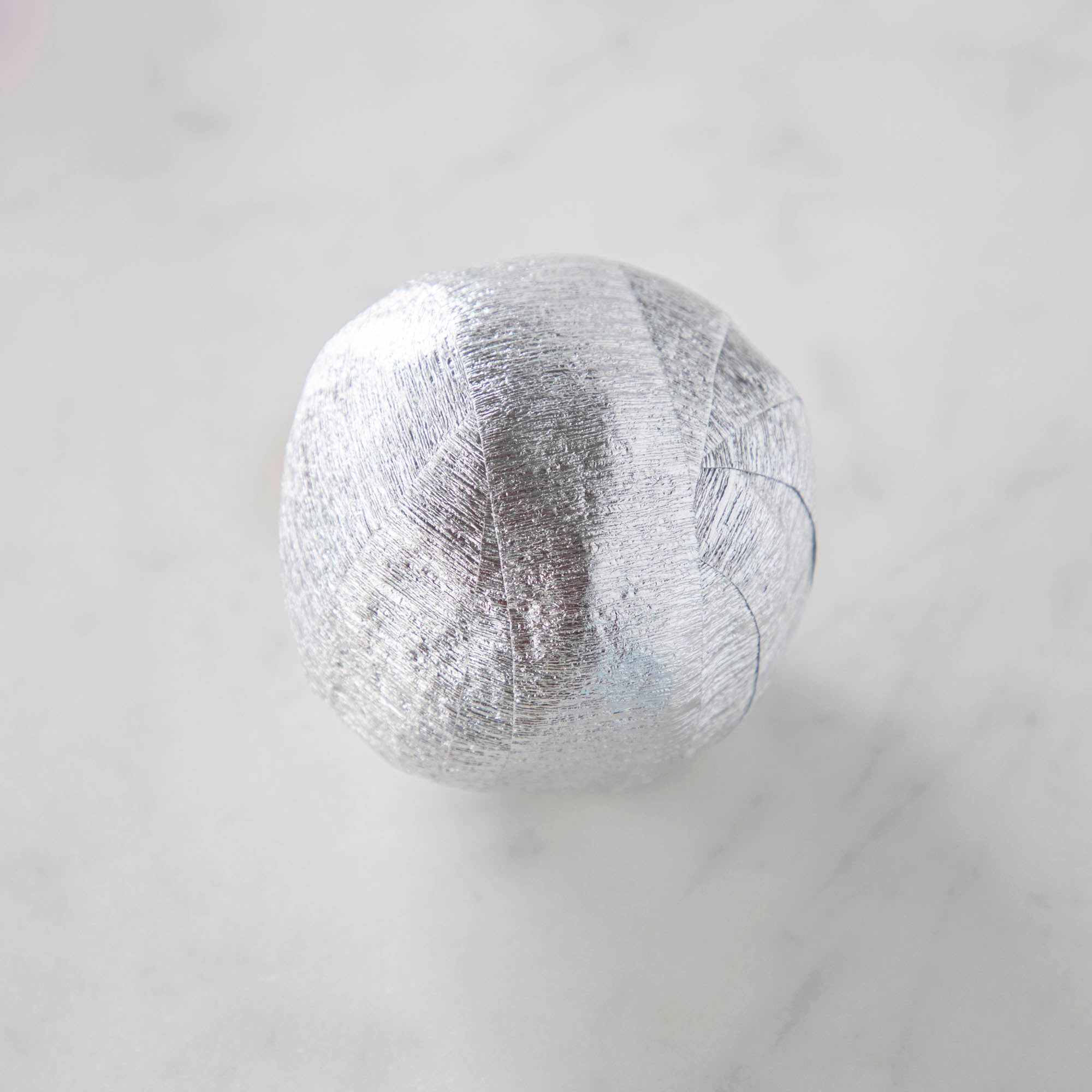 Vintage-inspired Mini Surprize Balls in a white bowl with confetti by Tops Malibu.