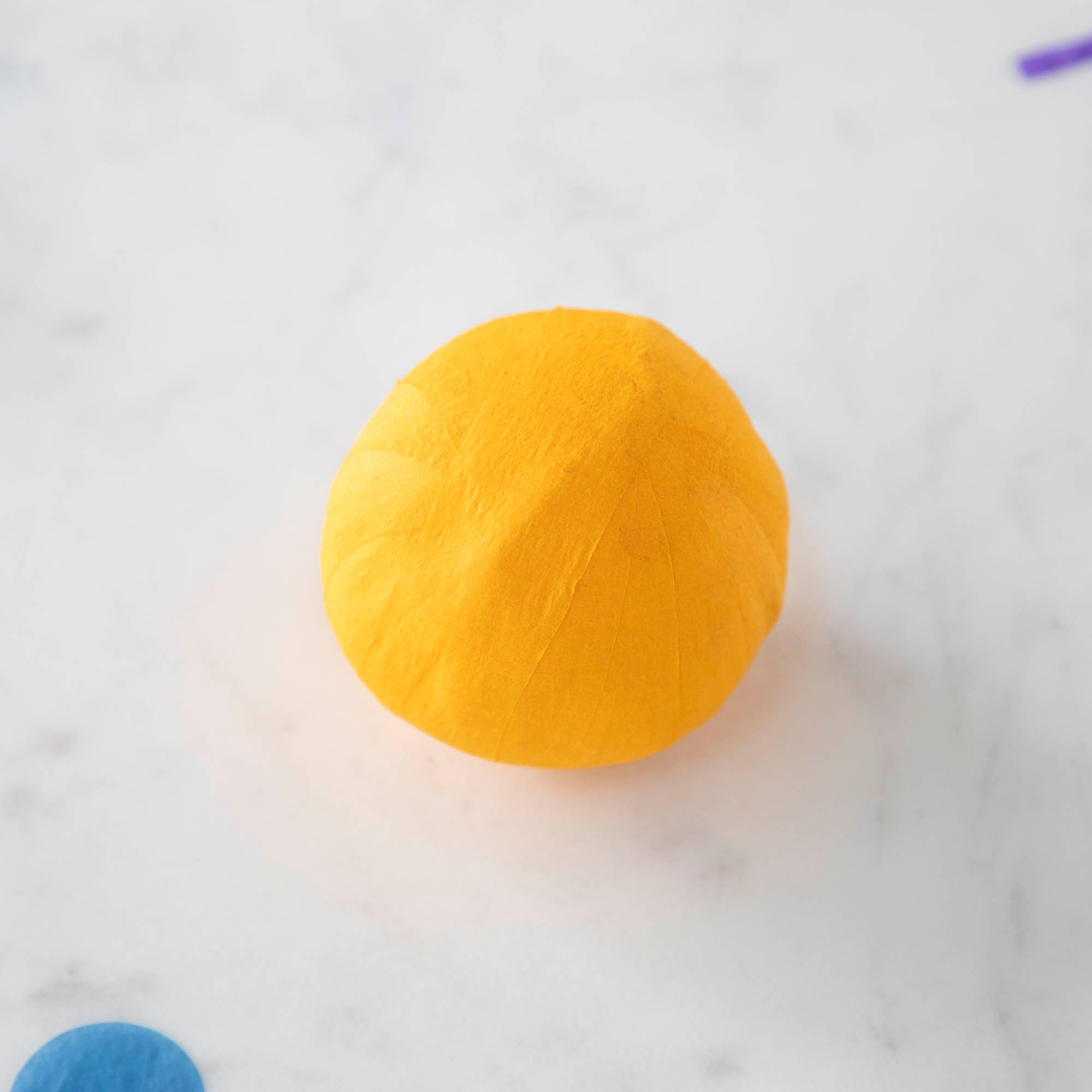 Vintage-inspired Mini Surprize Balls in a white bowl with confetti by Tops Malibu.