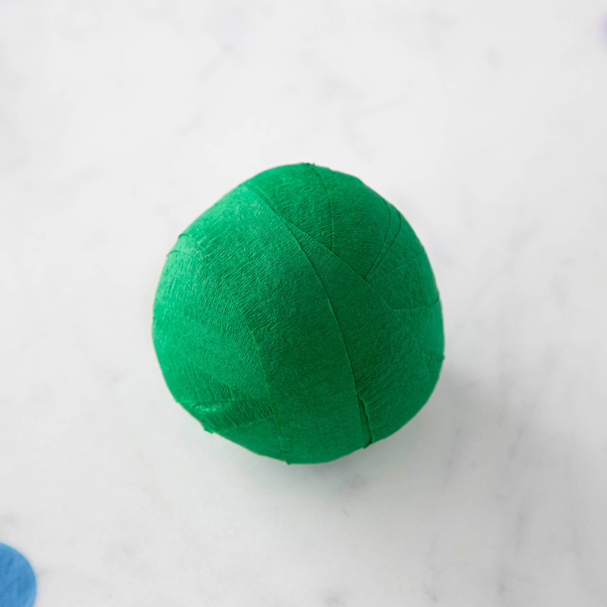 Vintage-inspired Mini Surprize Balls in a white bowl with confetti by Tops Malibu.