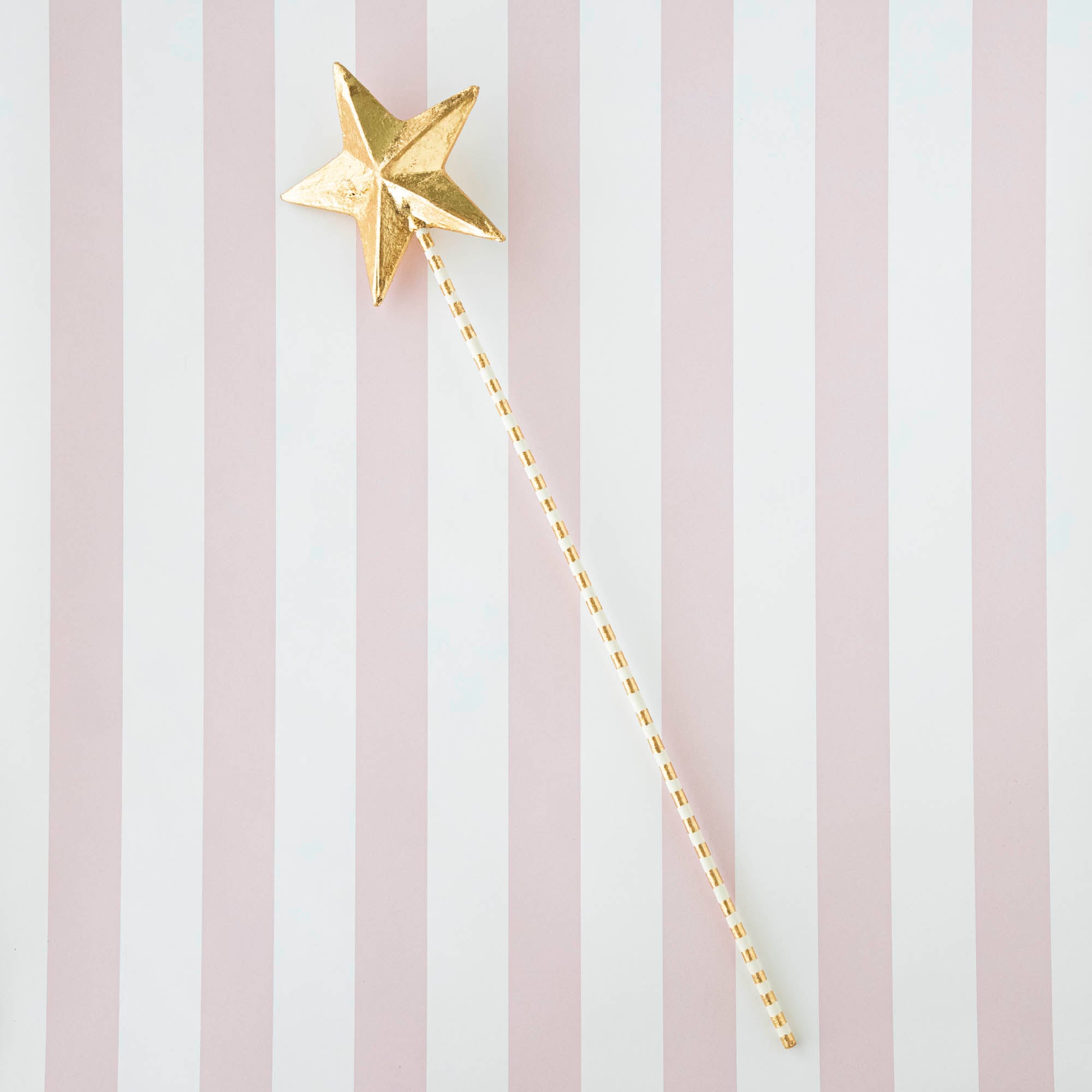 Five Glitterville Magic Wands on a striped background.