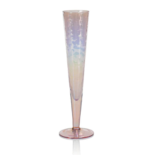 Four Zodax Luster Slim Champagne Flute Glassware with a champagne bottle in an ice bucket in the background.