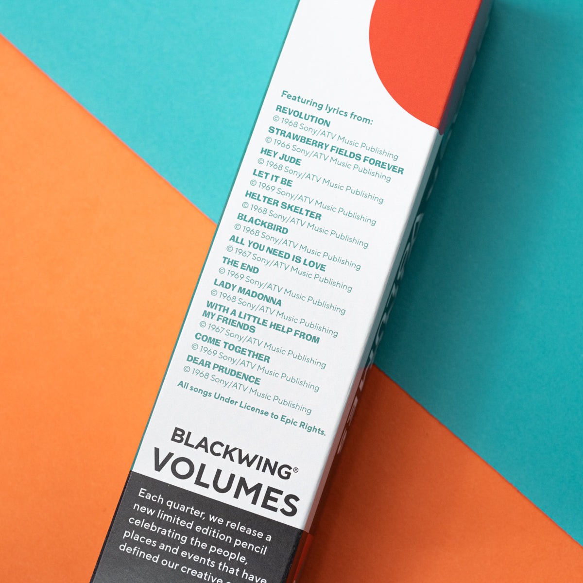 A group of Blackwing Volume 192- Tribute to John Lennon and Paul McCartney (Set of 12) colored pencils with a quote on them about songwriting by John Lennon and Paul McCartney.