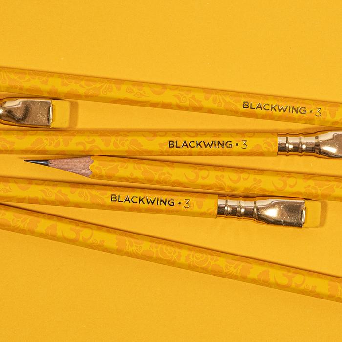 Three Blackwing Volumes 3- Tribute to Musician Ravi Shankar pencils aligned in parallel against a yellow background.