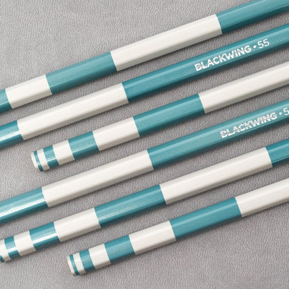 A set of Blackwing Volume 55- Tribute to the Golden Ratio pencils with a blue and white stripe on them, designed with the Golden Ratio for perfect symmetry.