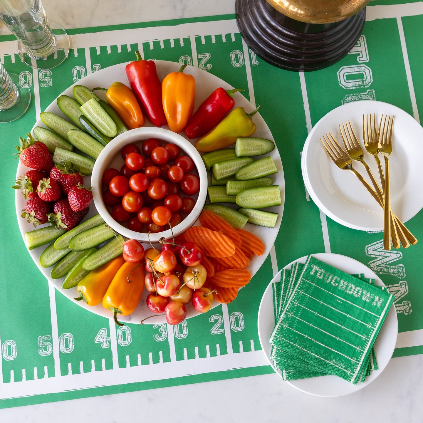 A Marble Chip & Dip Server with various fruits & veggies atop on the Touchdown Runner.