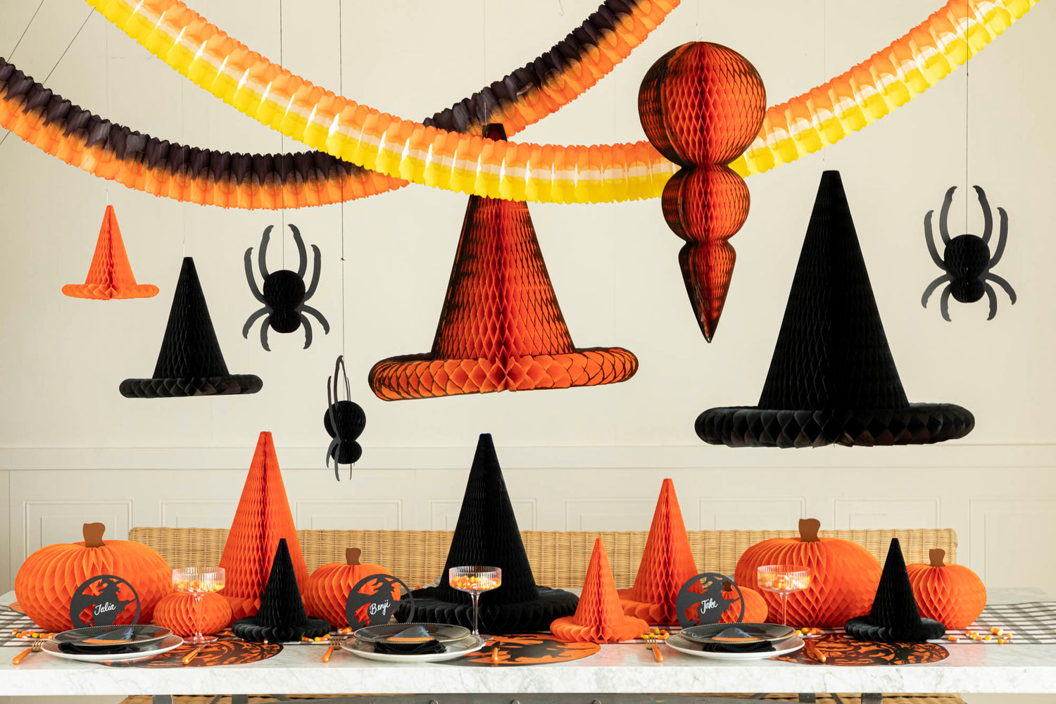 Honeycomb Halloween Paper strung across a Halloween themed table.