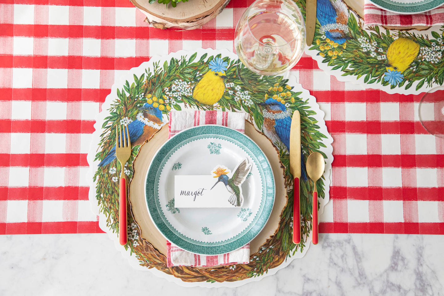 A garden party themed place setting featuring the Die-cut Songbird Wreath Placemat.