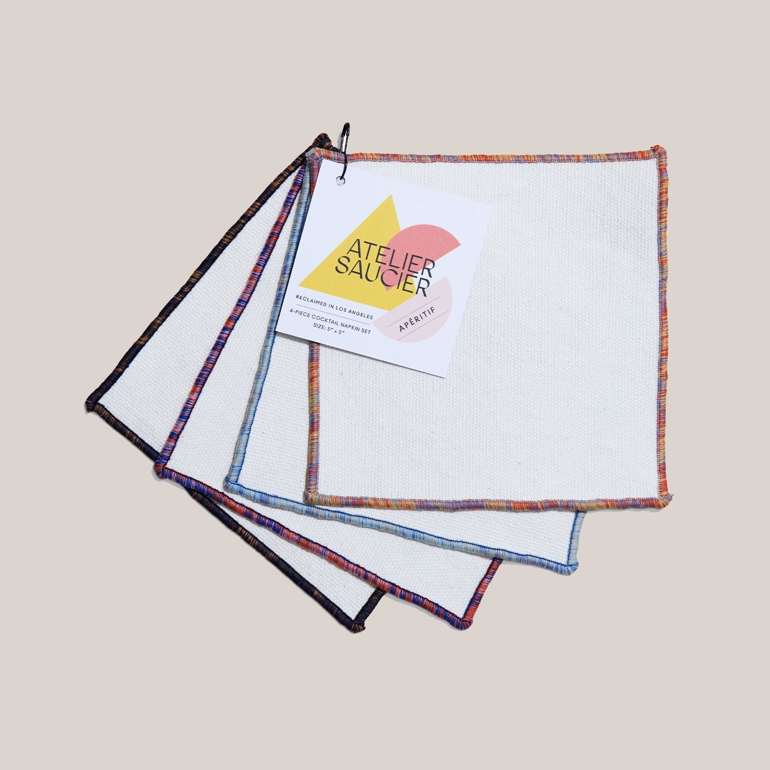 Rainbow Sky Cocktail Napkin Set of 4 against a beige background with &