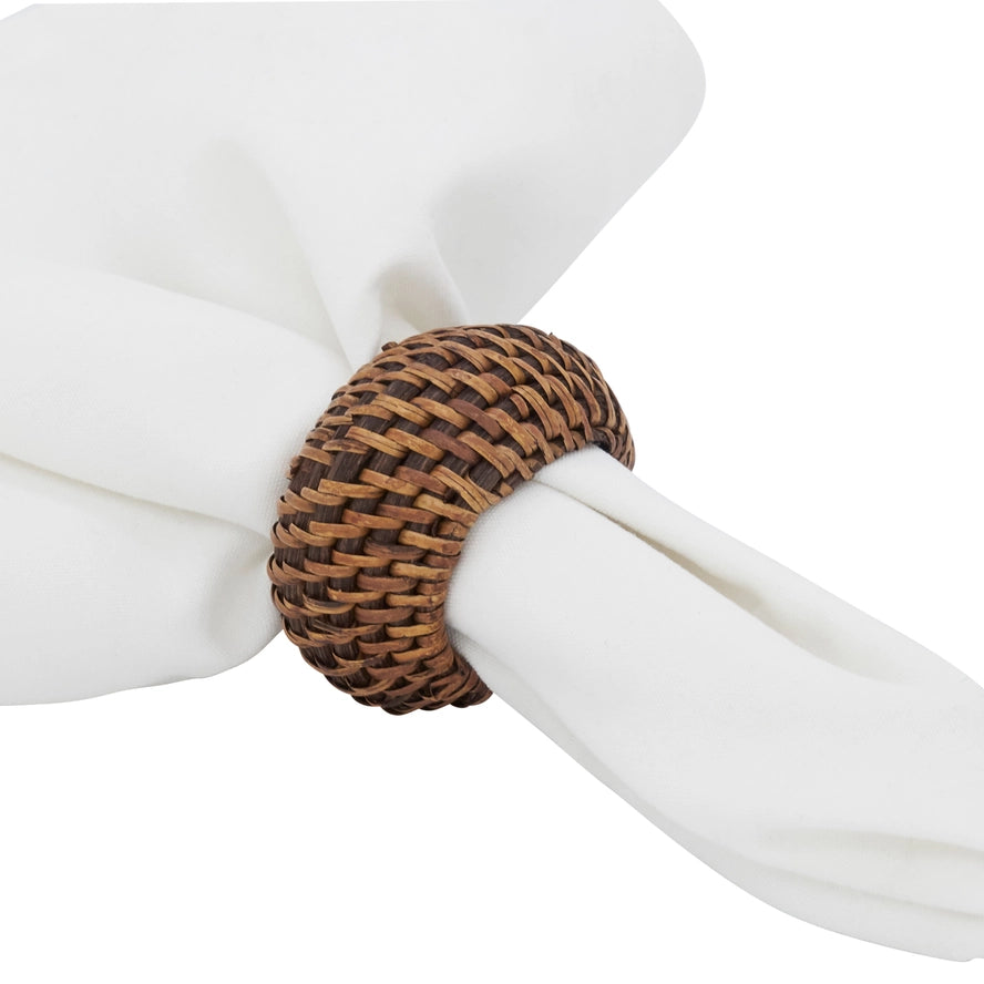 Woven napkin ring on a white napkin against a white background