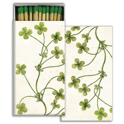 A box of matches with clover illustrated on them. 