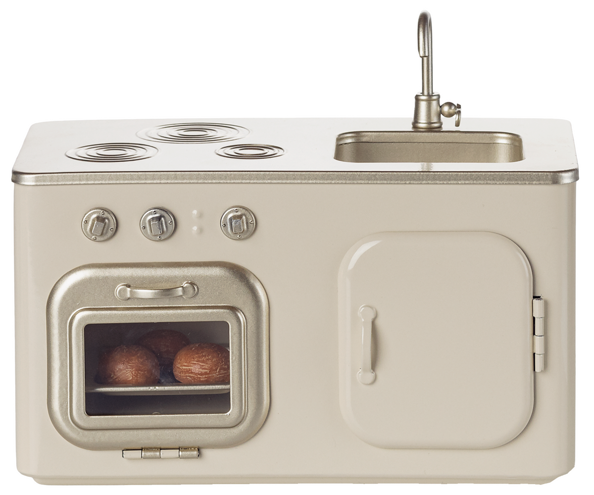 Beige vintage-style kitchenette with stove, oven, and sink on a white background.