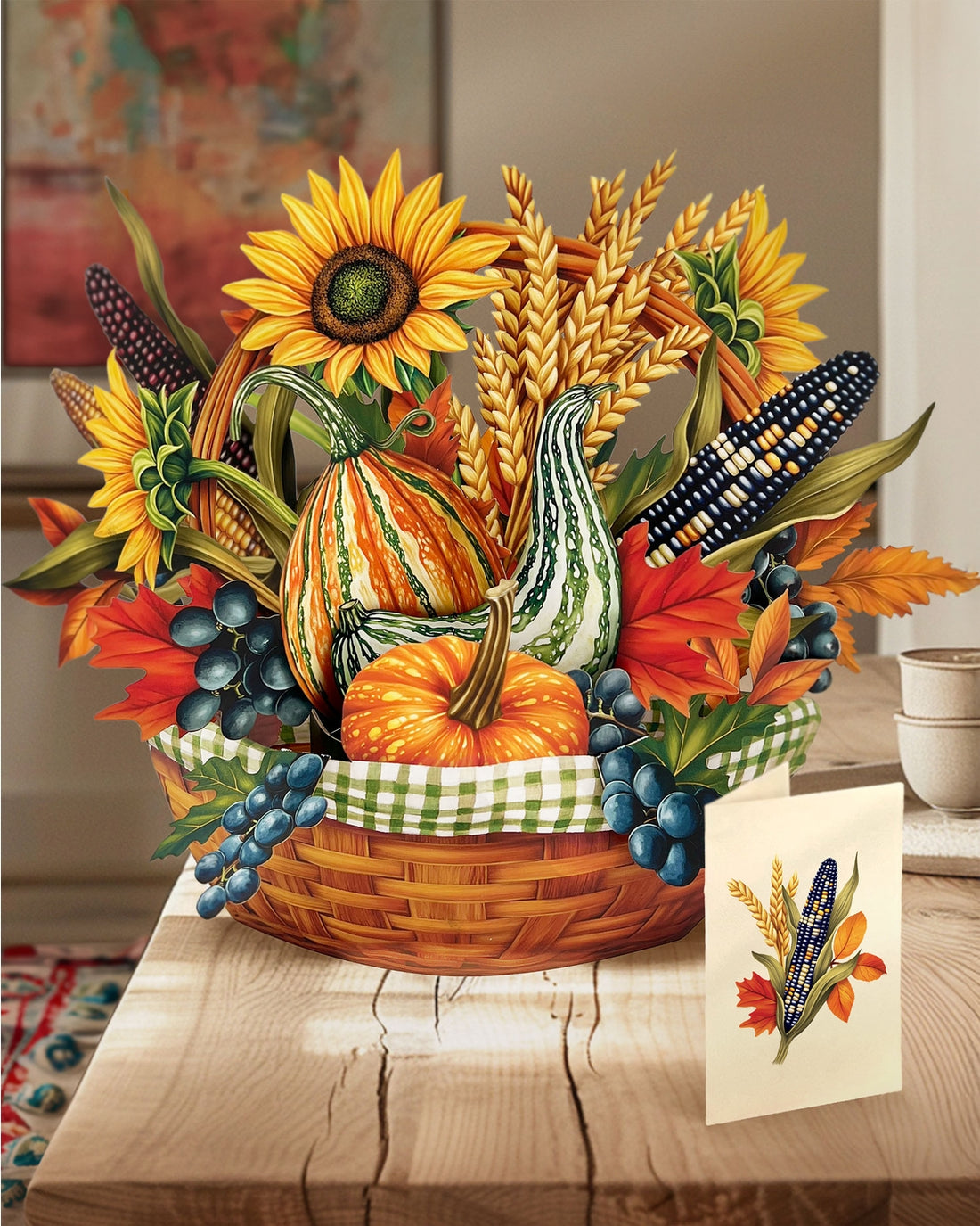 Paper decorative Thanksgiving basket with pumpkins, sunflowers, and gourds on a wooden table.