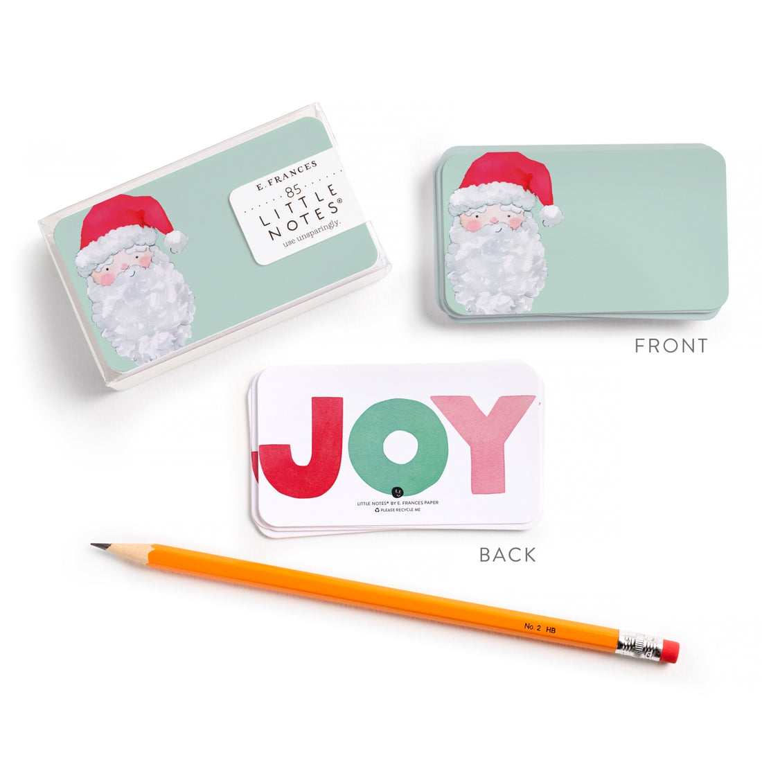 Set of Christmas-themed note cards with Santa hats and a pencil on a white background