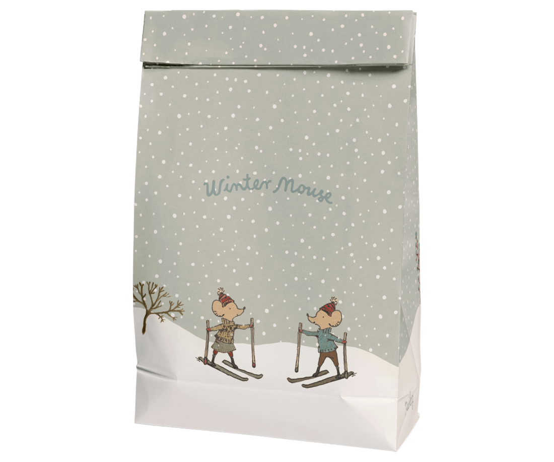 Paper gift bag with 2 mice on skis printed on it.