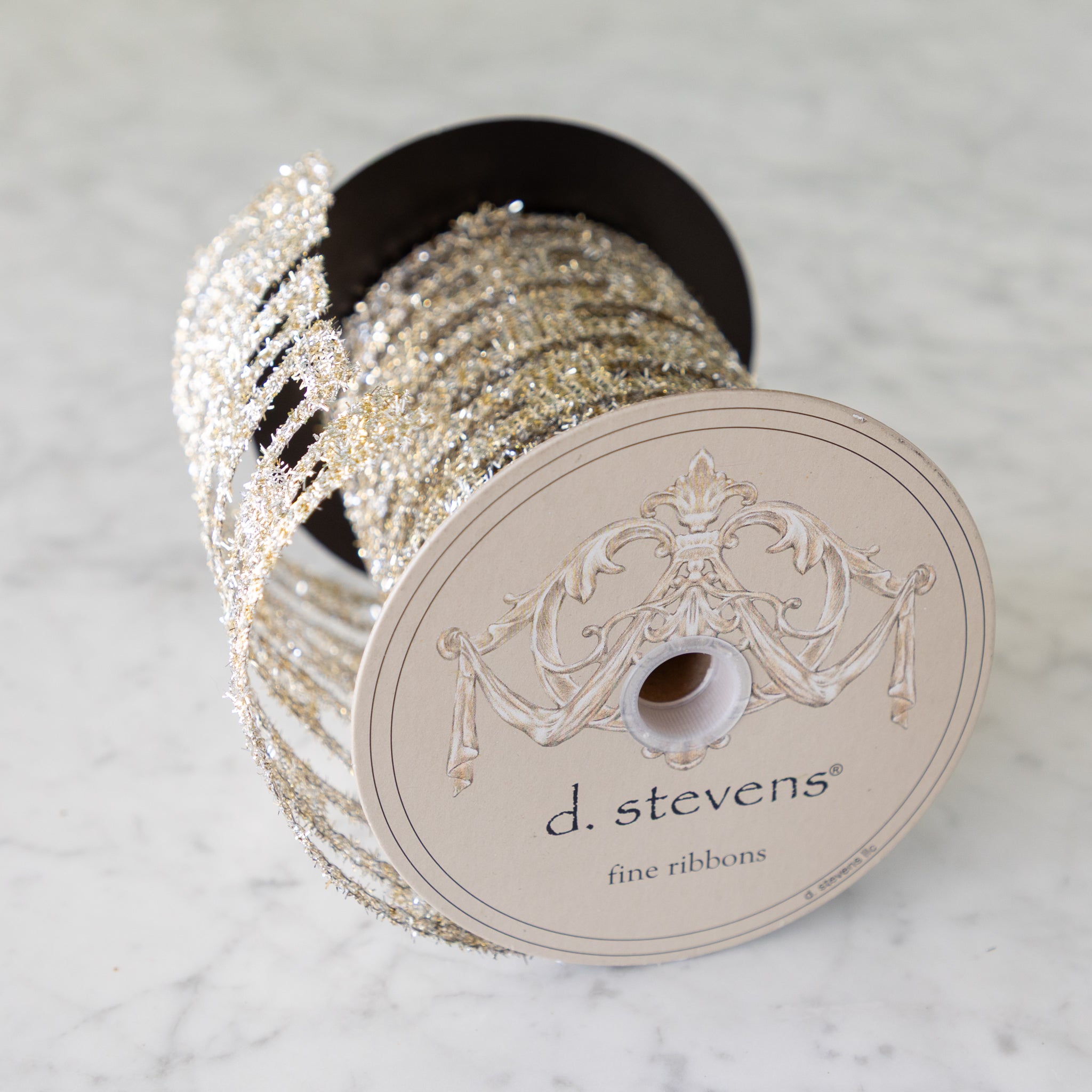 Spool of glittery ribbon with &