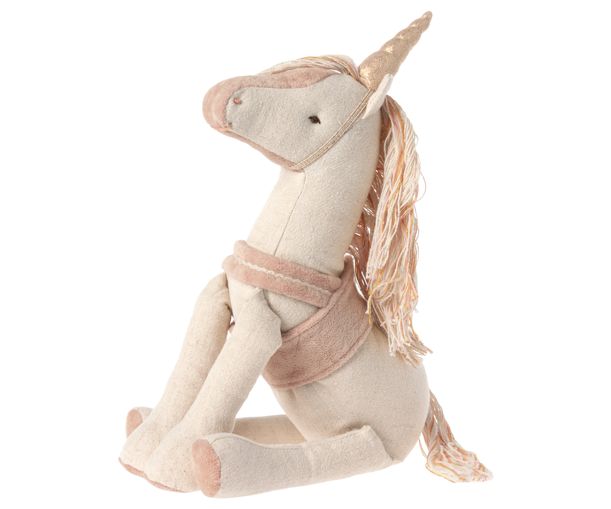 stuffed unicorn seated