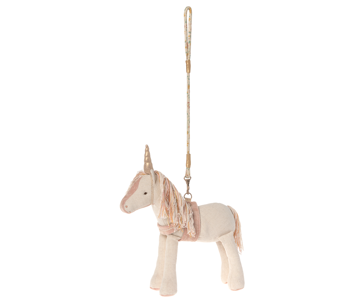 stuffed unicorn shown with its leash