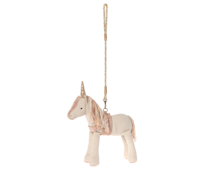 stuffed unicorn shown with its leash