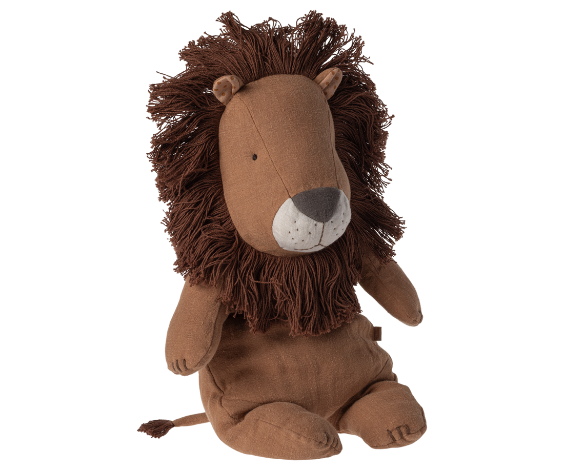 Stuffed animal in the shape of a lion sitting