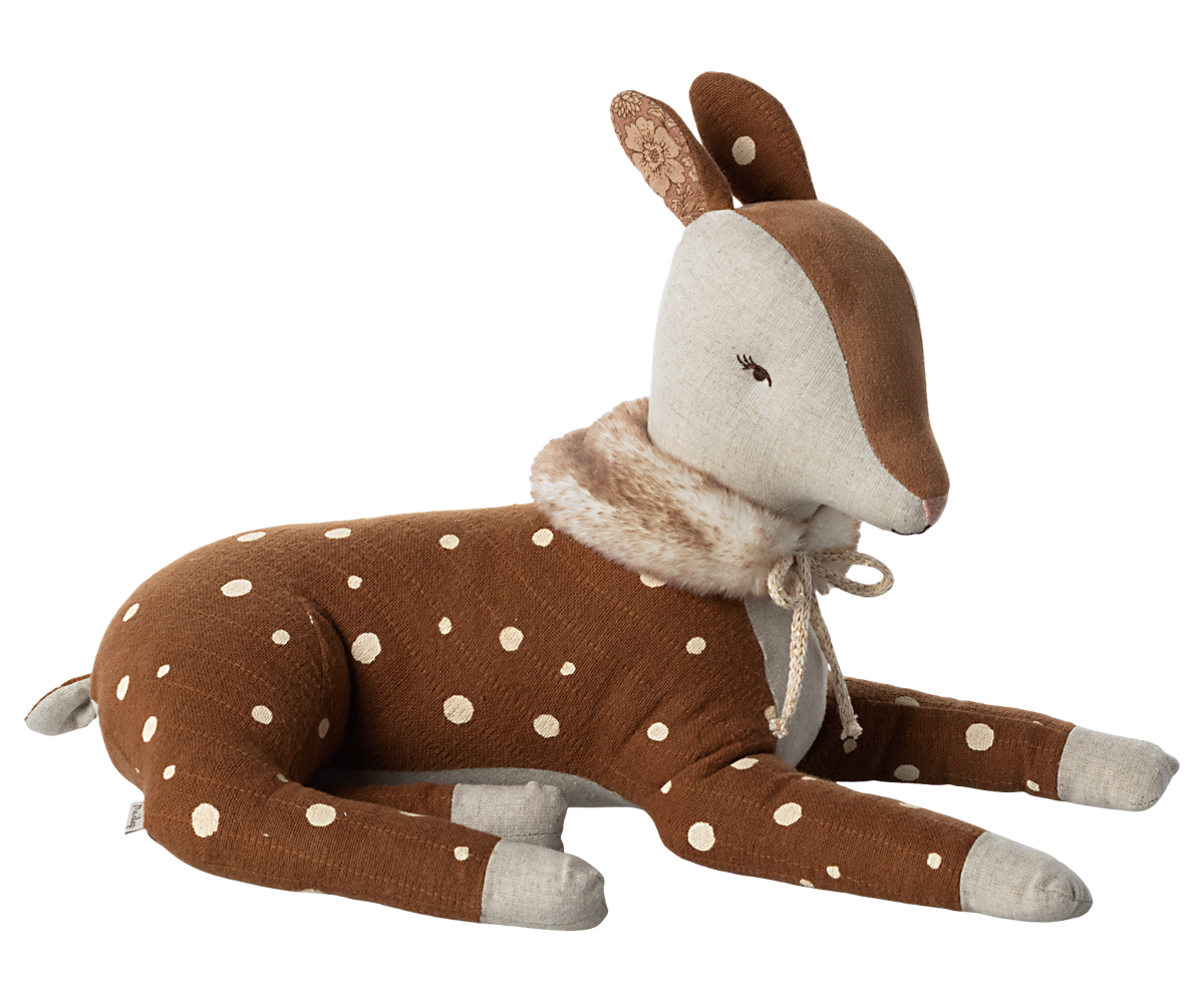 Stuffed animal brown deer with white spots and a faux fur scarf tied with a off white bow