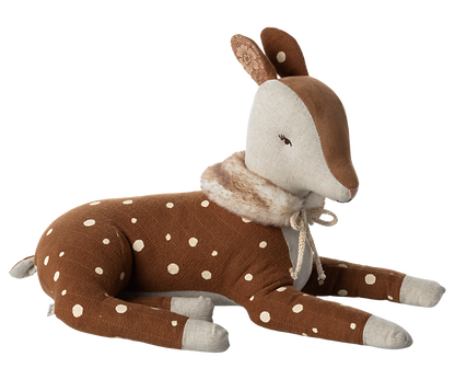 Stuffed animal brown deer with white spots and a faux fur scarf tied with a off white bow