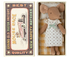 A vintage style Big Sister Mouse in Matchbox bed featuring a graphic of a Maileg mouse race car with text, next to a cotton linen toy mouse in a dress resting in an open matchbox.