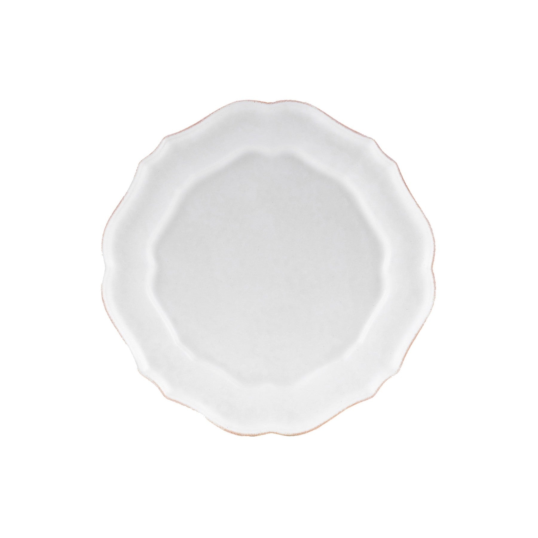 White ceramic plate with scalloped edge on a white background.