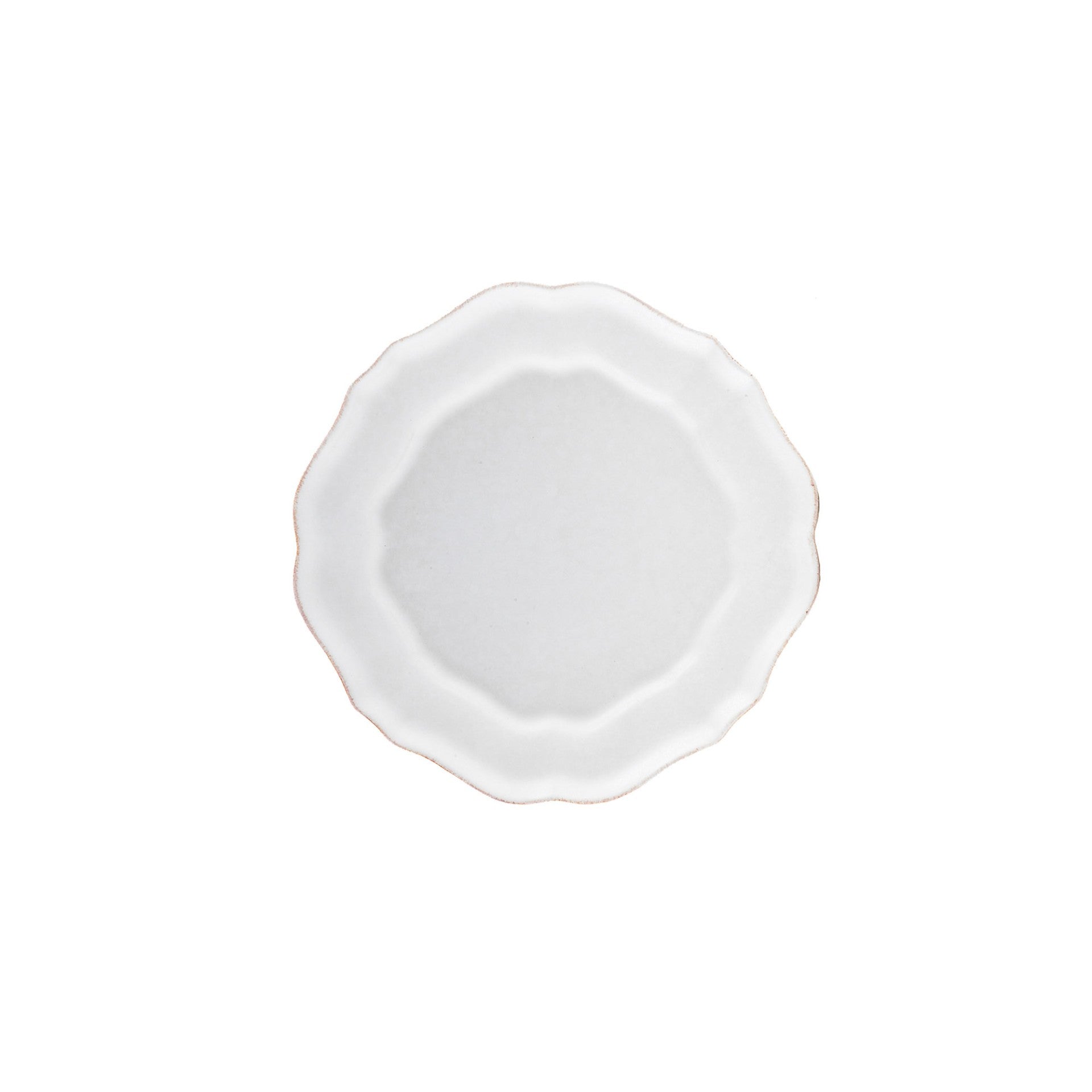 White ceramic plate with scalloped edge on a white background.