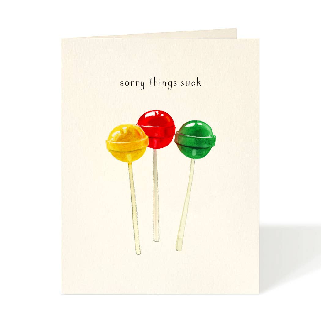 Greeting card by Felix Doolittle with artwork of 3 lollipops and the sentiment above saying "sorry things suck". 