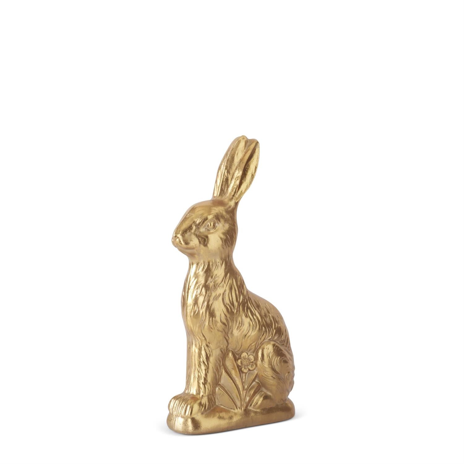 Gold rabbit figurine on a white background