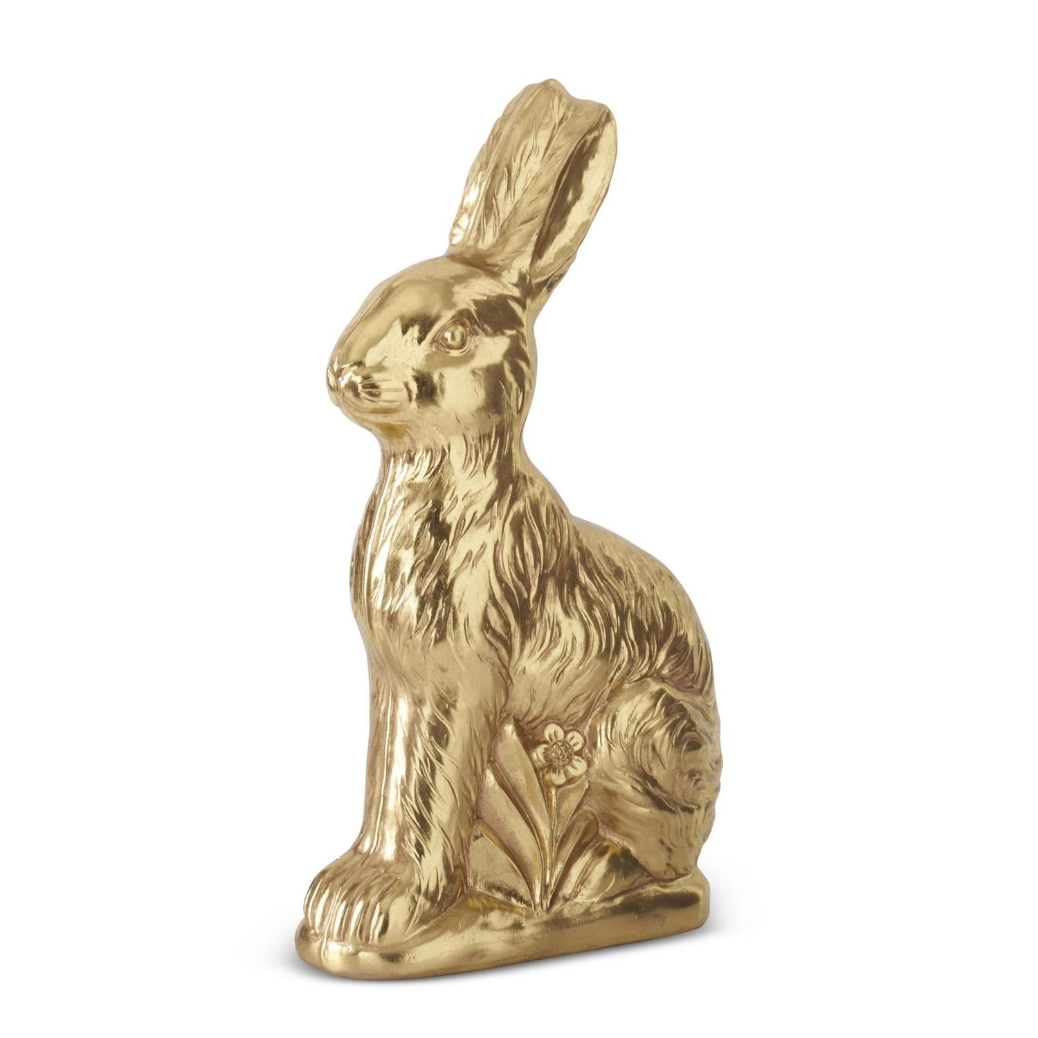 Gold rabbit figurine on a white background