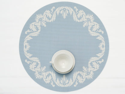 Scroll Round Placemat with teacup on it in Sea color