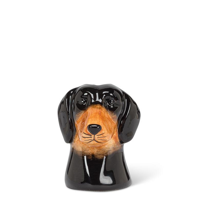 Dog-shaped black and brown ceramic vase on a white background.