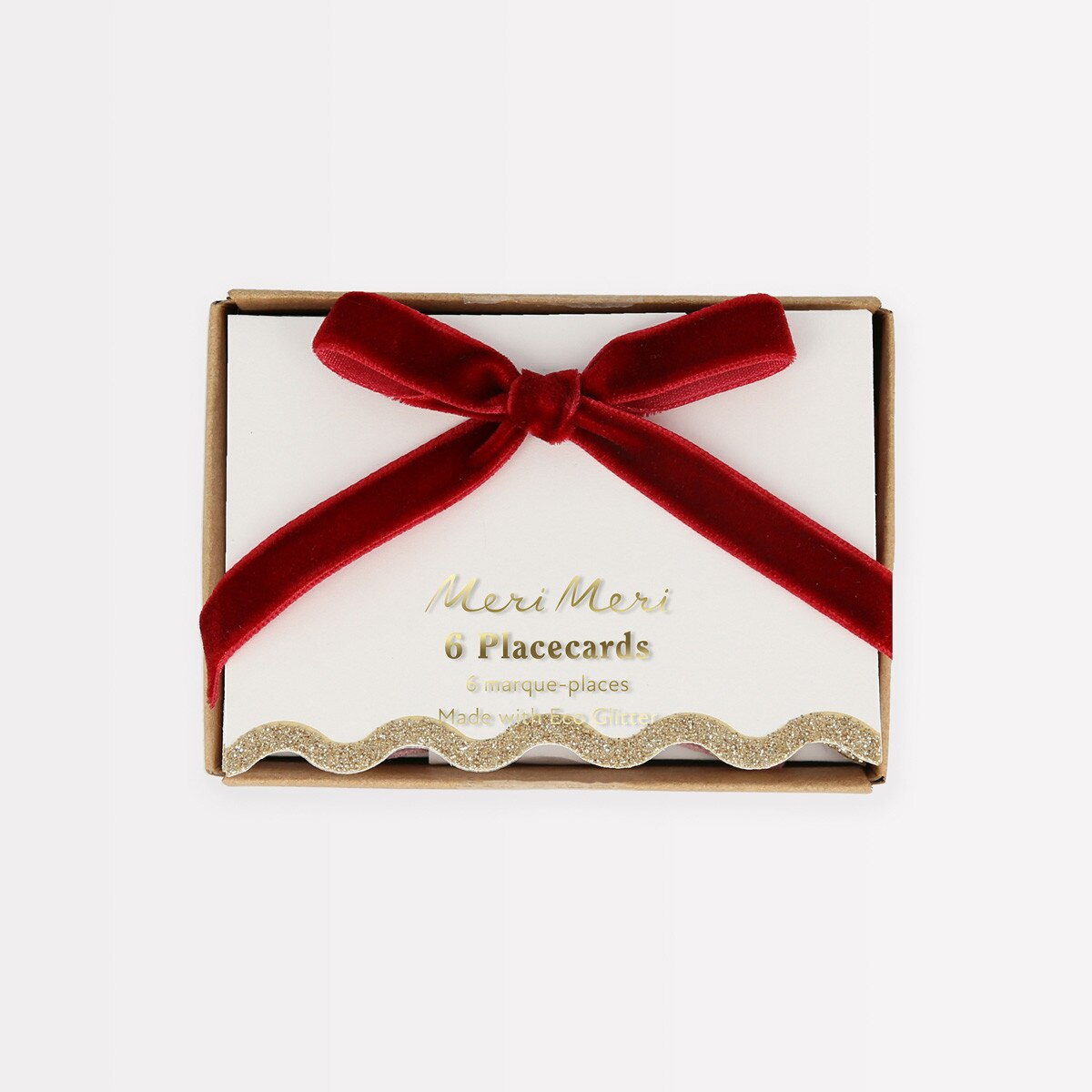 Box of placecards with a red ribbon on a white background