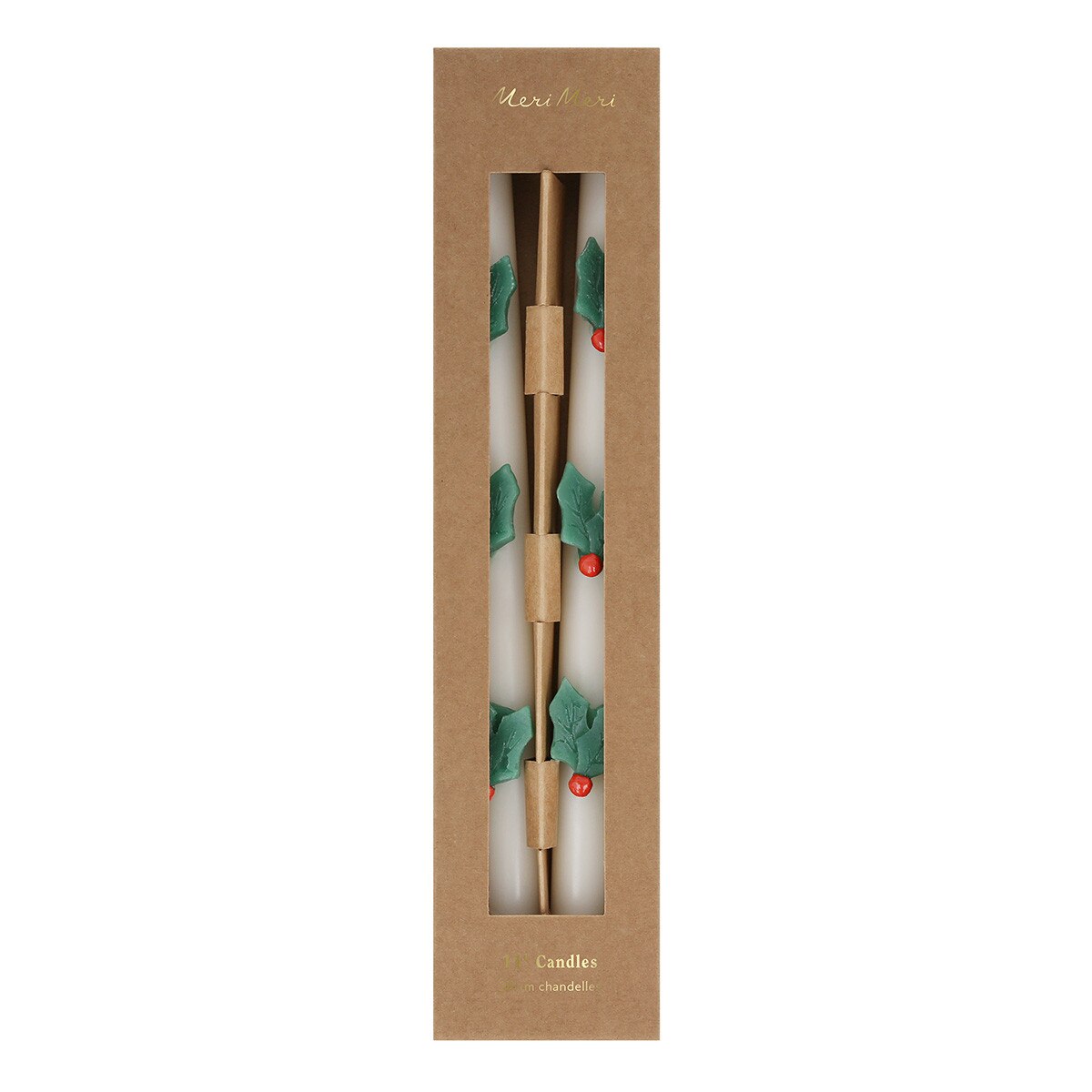 A boxed set of holiday-themed candles in a tall, narrow kraft paper package with a clear window. The candles have metallic gold handles and white wax, decorated with green holly leaves and small red berries.