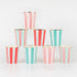 Stack of red and green striped paper cups on a white background