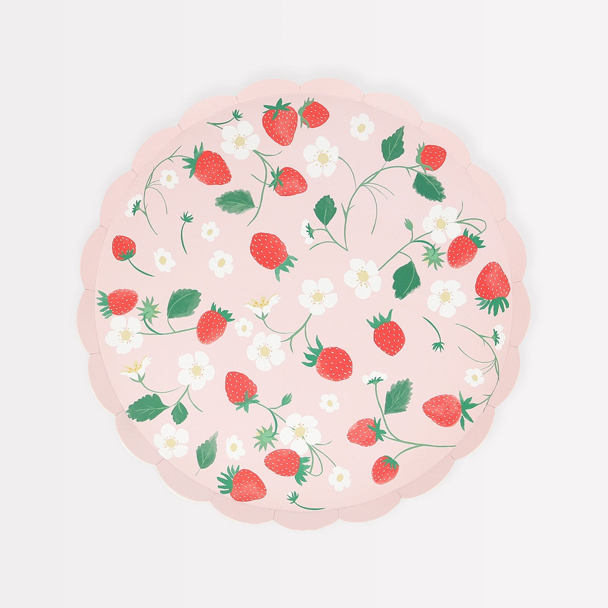 Round pink plate with strawberry pattern on a white background.