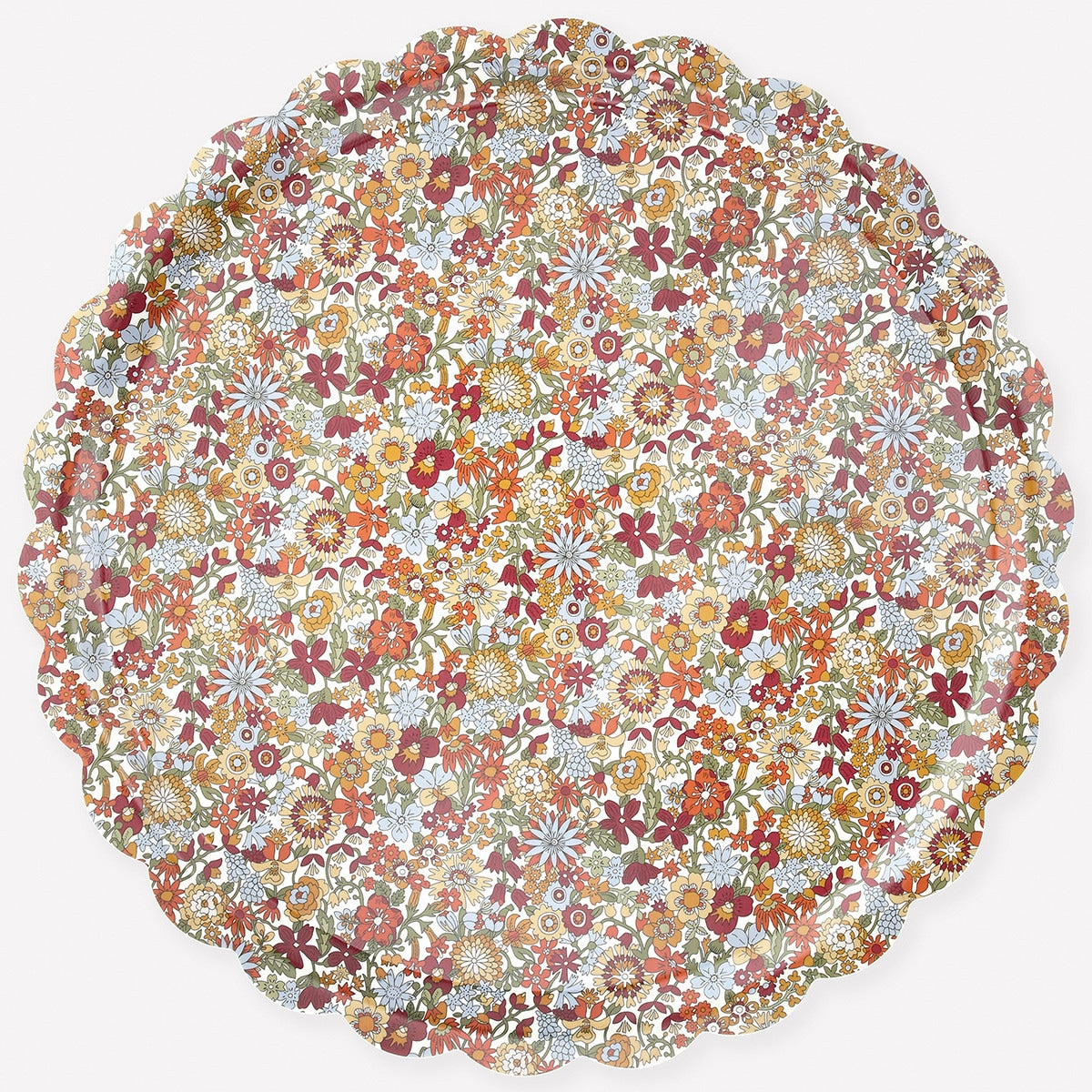 Round Liberty of London floral patterned tray with scalloped edge on a white background. 