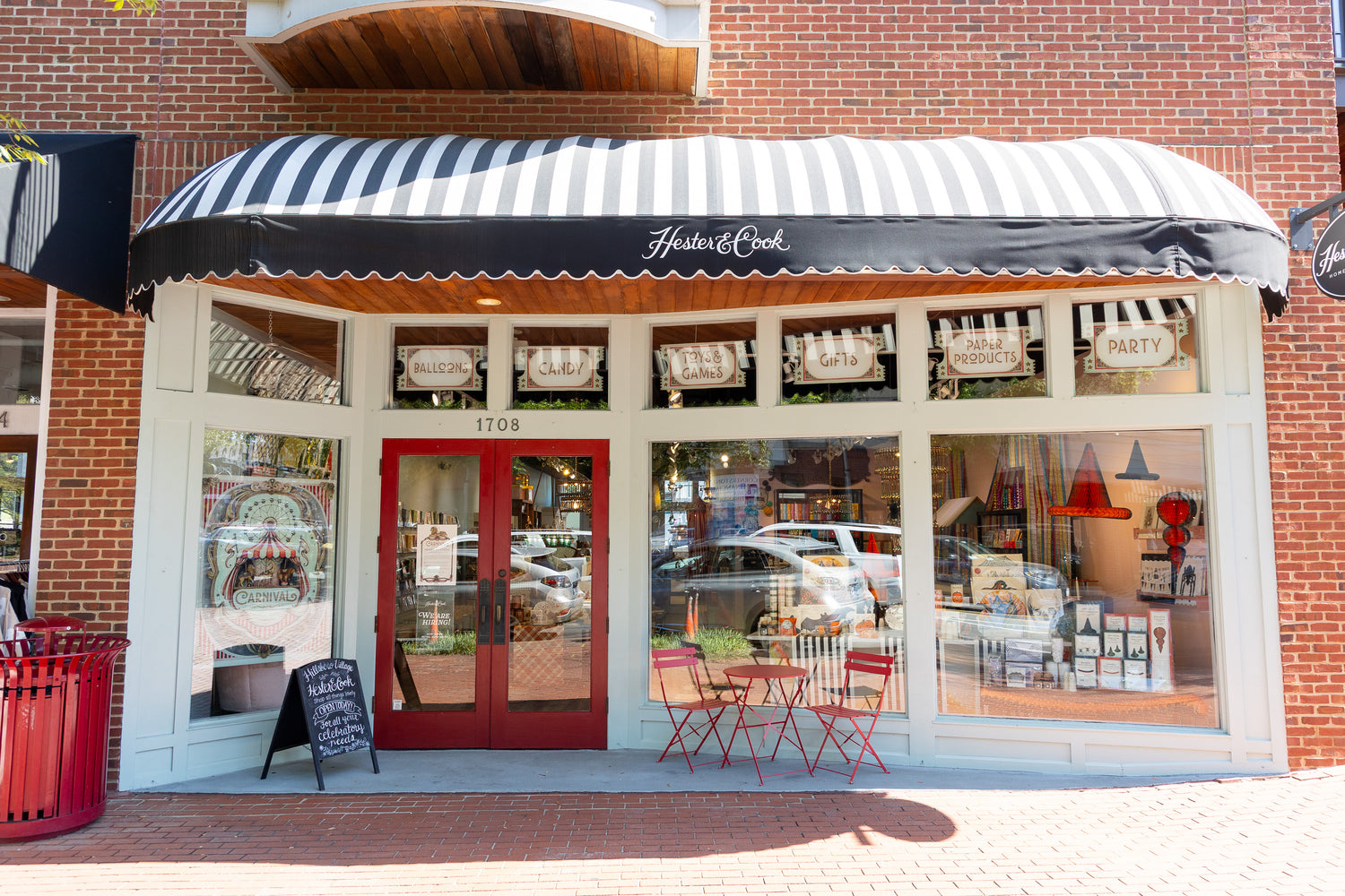 Front of store location with striped awning. 