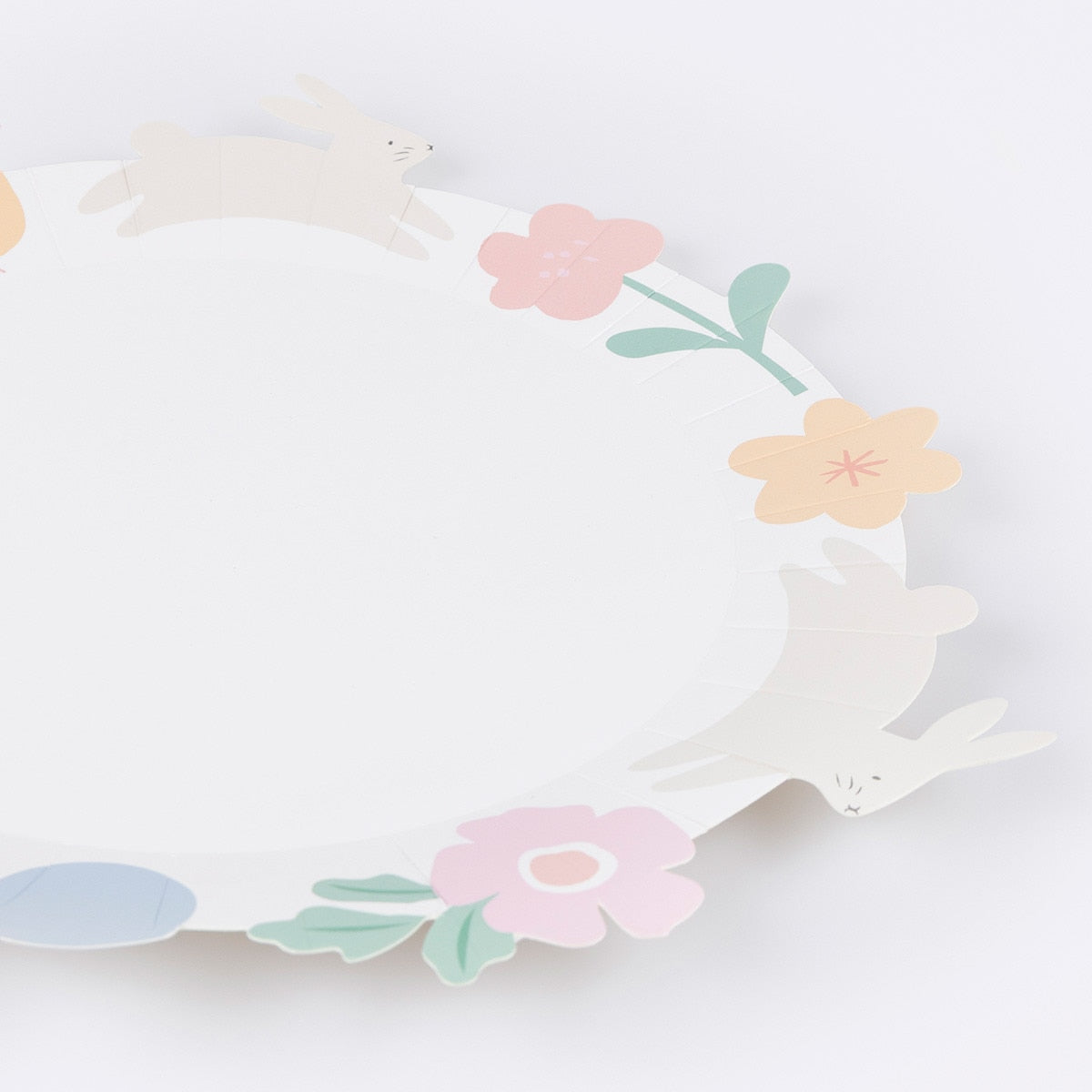 Floral-themed paper plate with pastel colors on a white background.