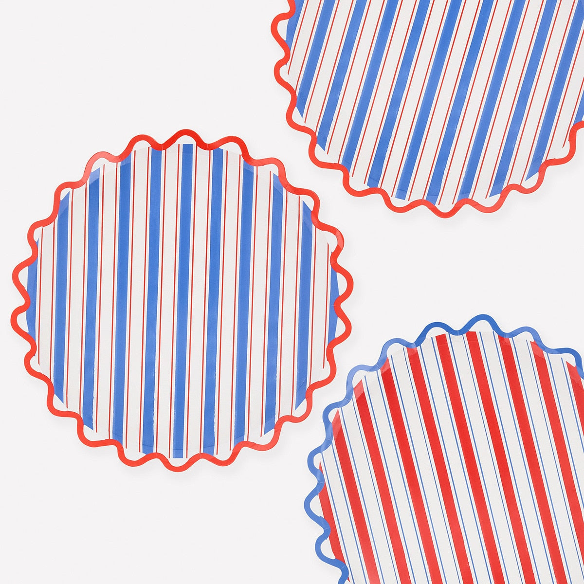 Red, white, and blue striped paper plate on a white background.