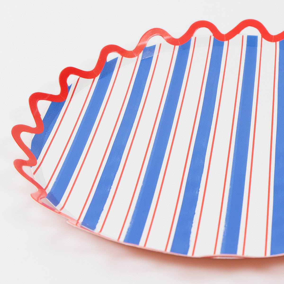 Striped paper plate with red, white, and blue pattern on a white background.