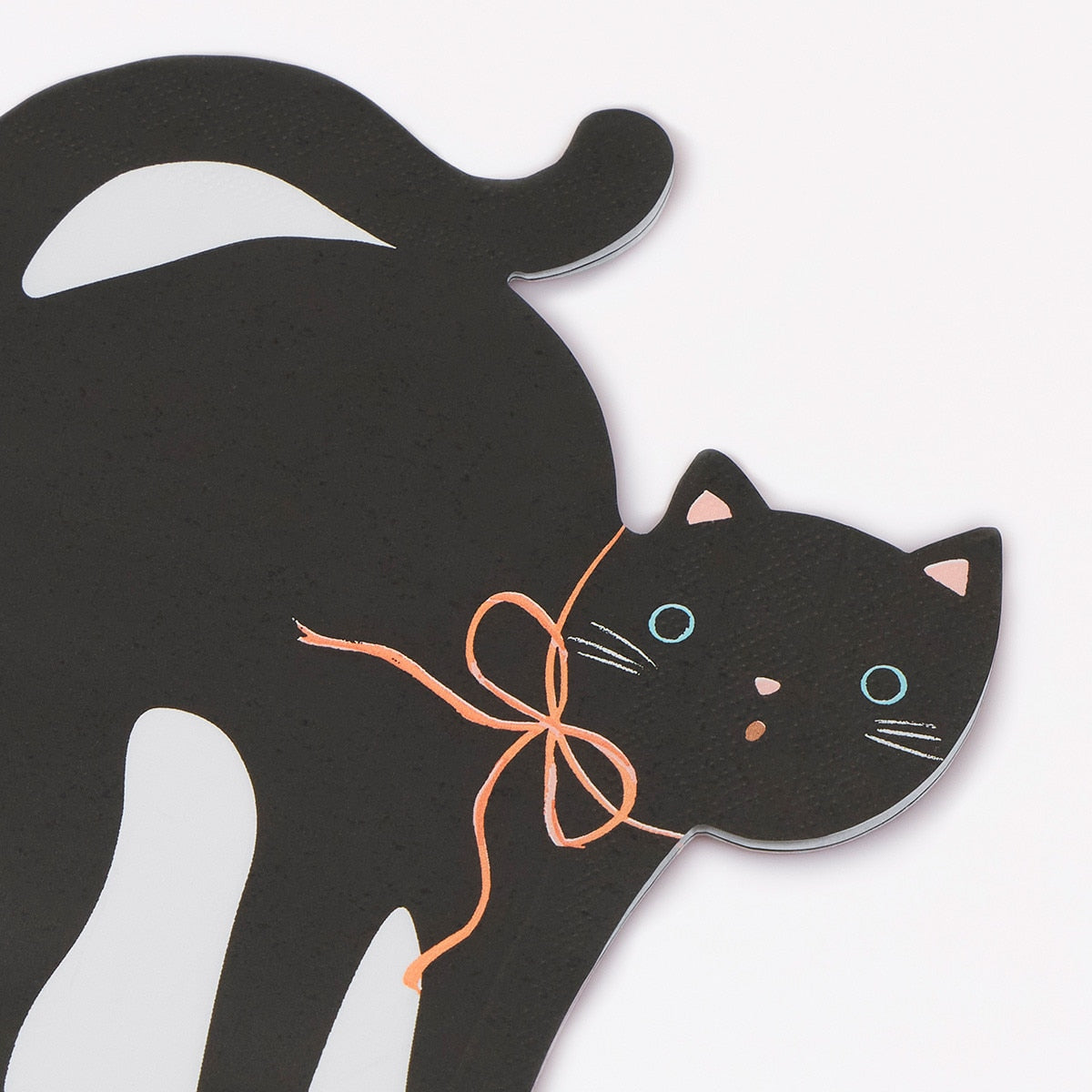 Black cat-shaped card with a bow on a white background.