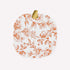 Pumpkin shaped white plate with orange floral pattern on a white background. 