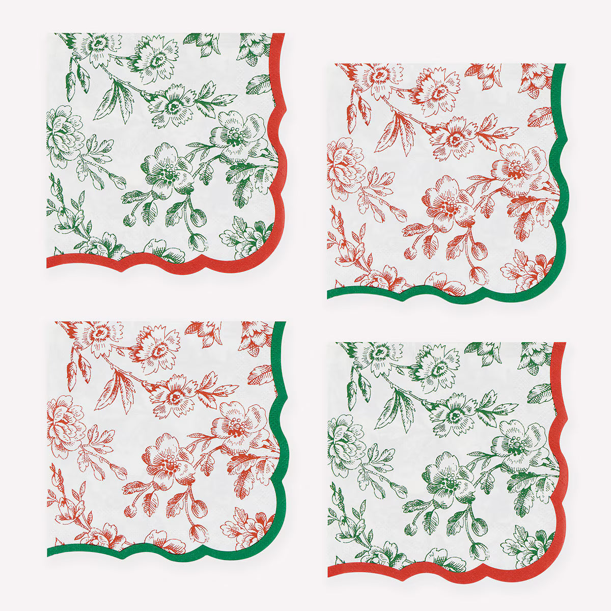 Four square paper napkins arranged in a 2x2 grid on a white background. Each napkin has a white base with a floral toile-style print in green or red and a matching scalloped border.